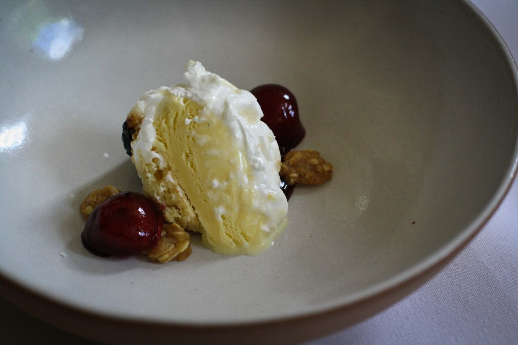 Baked Alaska with rum, caramel and cherry