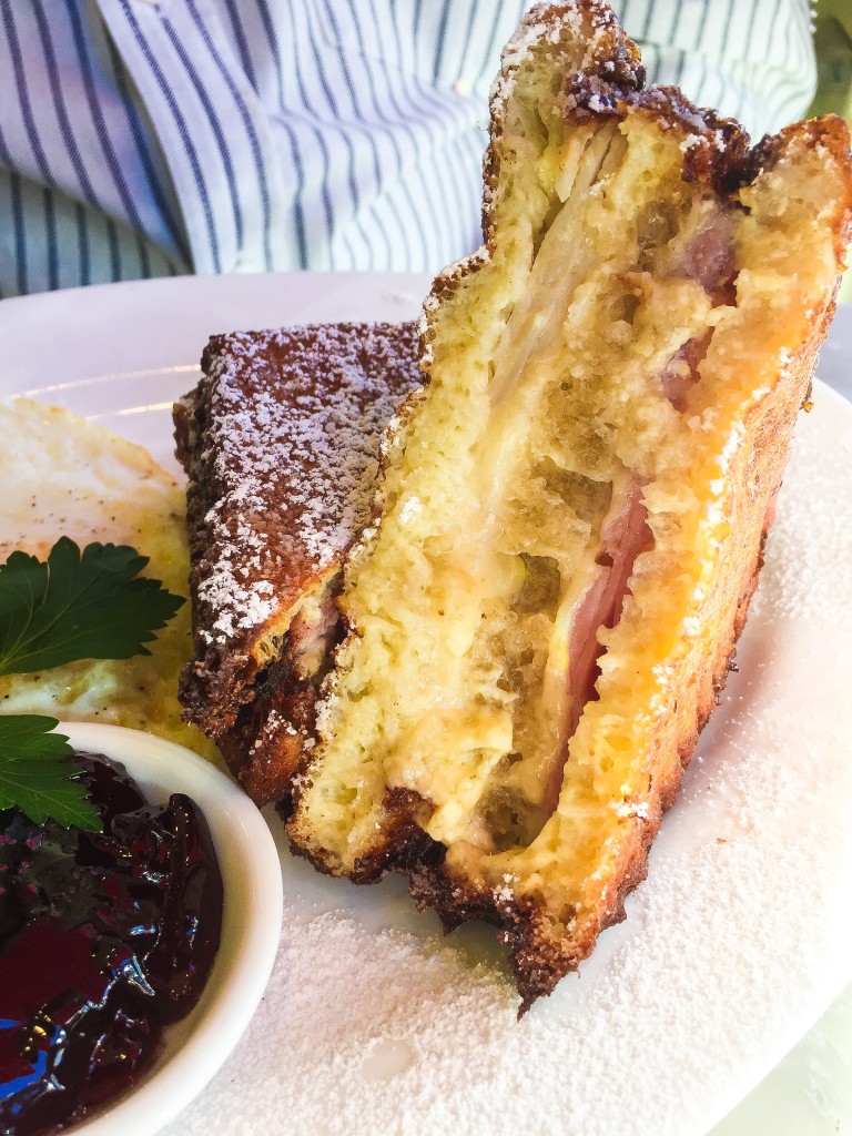 Monte Cristo - $17 Triple-decker ham, turkey and Swiss cheese sandwich, custard-style battered and deep fried. With fried eggs and red currant jelly.