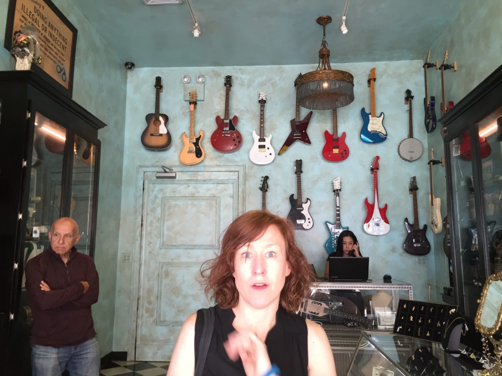 You enter the restaurant through an upscale pawn shop. My friend appears beyond delighted that I'm snapping her photo.