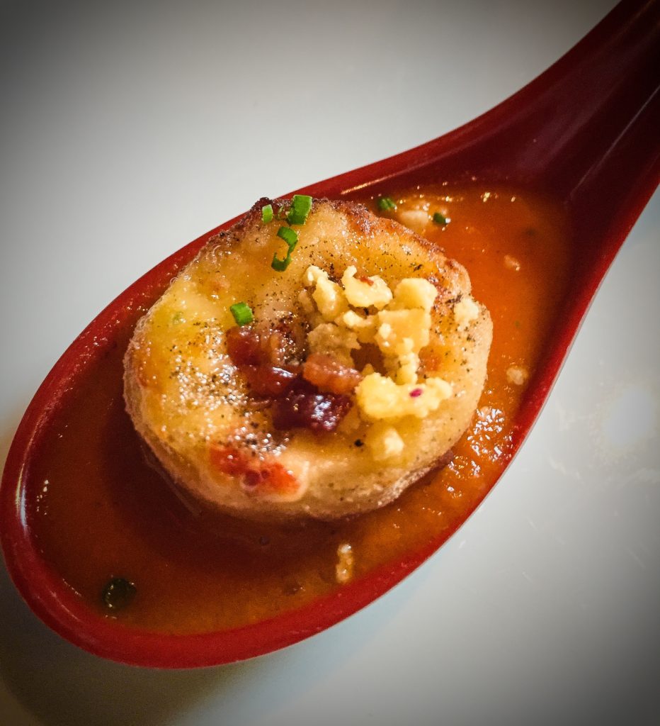 Grilled Cheese Dumpling (on spoon filled with tomato soup)